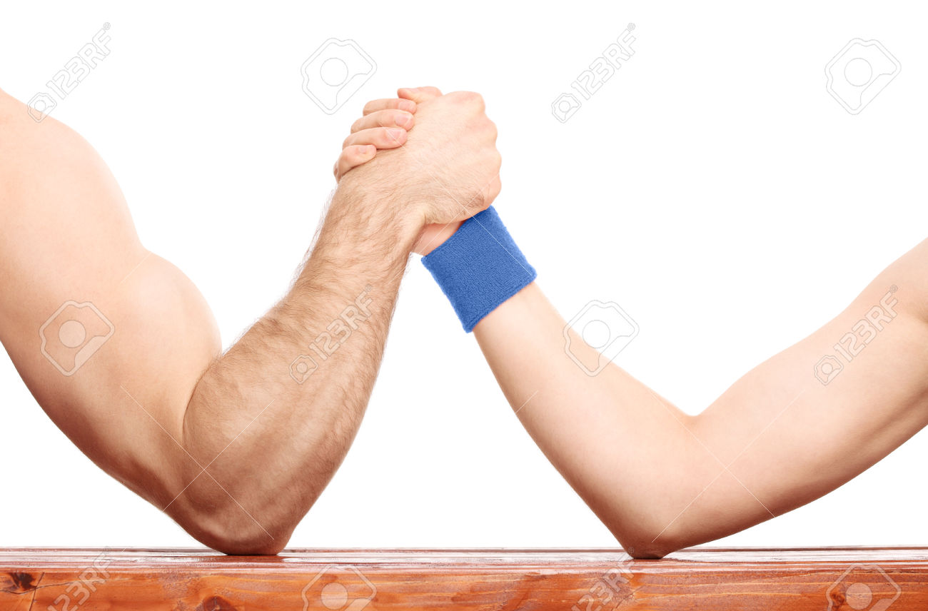 Close-up on an uneven arm wrestling contest between a muscular arm and a skinny one isolated on white background